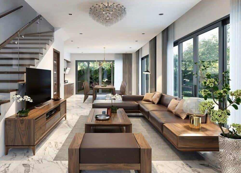 cách kê bàn ghế gỗ phòng khách nhà ống đối diện cầu thang